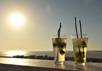 Rum mojitos at a beach bar chiringuito on the Costa del Sol, holidays in Spain - obrazy, fototapety, plakaty