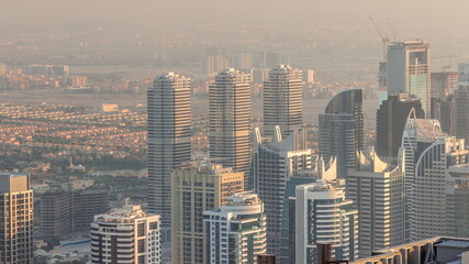 Fototapeta na wymiar Jumeirah Lakes Towers district with many skyscrapers along Sheikh Zayed Road aerial timelapse.