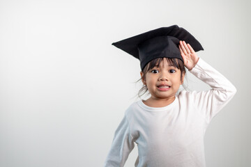 Happy Asian school kid graduate in graduation cap