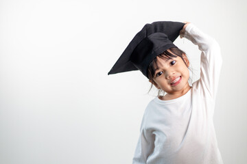 Happy Asian school kid graduate in graduation cap