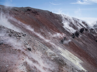 Caldera of Avachinsky stratovolcano, also known as Avacha Volcano. Swinging steam from hot geysers. Kamchatka Peninsula, Russia.