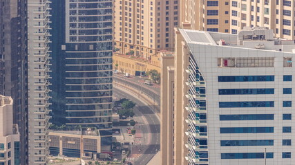 Aerial view of JBR and Dubai Marina skyscrapers and luxury buildings timelapse from above
