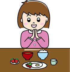 いただきますとごちそうさまをする子供