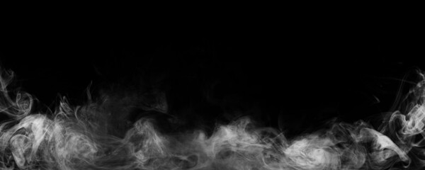 Panoramic view of the abstract fog. White cloudiness, mist or smog moves on black background. Beautiful swirling gray smoke. Mockup for your logo. Wide angle horizontal wallpaper or web banner.