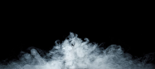 Panoramic view of the abstract fog. White cloudiness, mist or smog moves on black background. Beautiful swirling gray smoke. Mockup for your logo. Wide angle horizontal wallpaper or web banner.