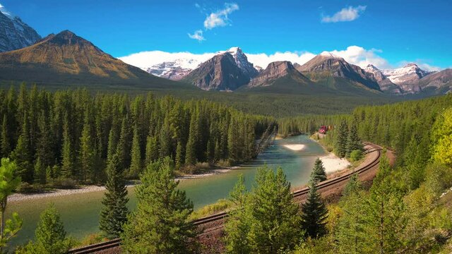 Train passing through Morant's Curve in bow valley, Canada