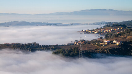 Town's overview through the fog (Régua, Portugal)