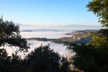 Town's overview through the fog (Régua, Portugal)