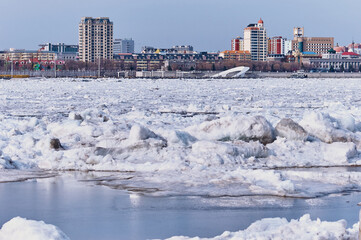 The beginning of the spring ice drift. View of the city of Heihe, China from the city of...