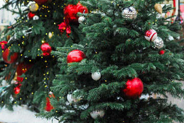 Fototapeta na wymiar Christmas tree with beautiful decor at the fair. Decorations at the holiday.