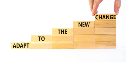 Adapt to the new change symbol. Wooden blocks with words Adapt to the new change on beautiful white...