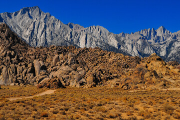 Morning light on Lone Pine Peak, Mount Whitney and the rock formations of the Alabama Hills National Scenic Area, Lone Pine, Eastern Sierra, California, USA