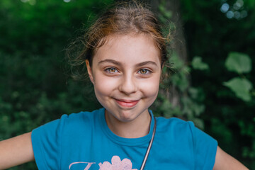 Portrait of a ten-year-old russian girl smiling to the camera