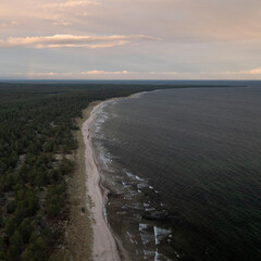 Coastal panorama at Lyckesand beach with ocean on the island of Oland in the east of Sweden from above in sunset.