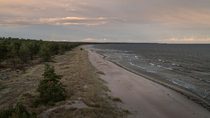 Coastal panorama at Lyckesand beach with ocean on the island of Oland in the east of Sweden from above in sunset.