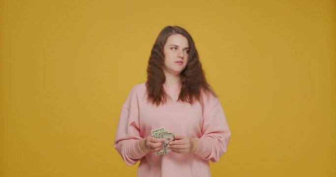 Upset young girl have lack of money, counting cash, last savings. Wrong budget planning, bankruptcy.