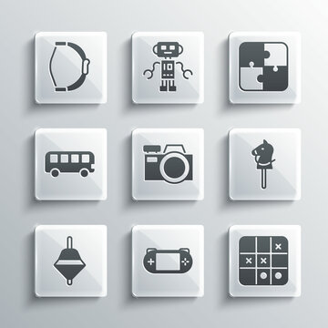 Set Portable video game console, Tic tac toe, Toy horse, Photo camera, Whirligig toy, Bus, Bow and Puzzle pieces icon. Vector