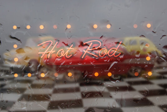 Neon Sign Neon Hot Rod Sign in wet window with vintage hot rod car in background - Powered by Adobe