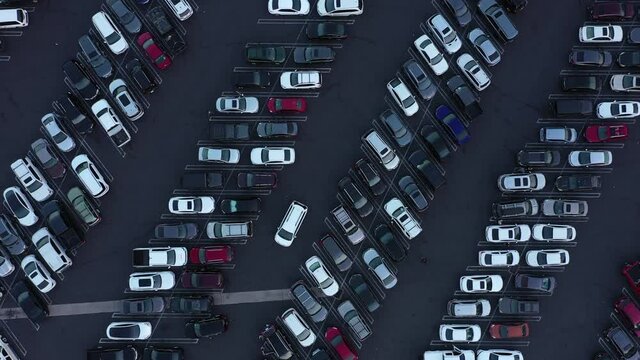 Aerial view of a parking lot full of cars during the holiday shopping season.