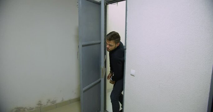 A man in handcuffs escapes from a prison cell that guards forgot to close