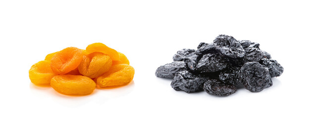 Dried prunes and dried apricots, isolated on white background. Collage of different dried fruits.