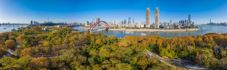 Fototapeta premium Autumn scenery of Wuhan Hanyang River Beach and Nan'anzui Park