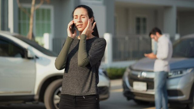 stress woman motorists calling insurance company on mobile phone to responsibility for car accident traffic collision after a car accident on the road with driver man