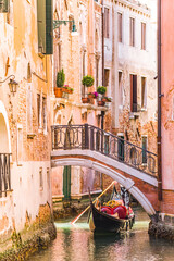 Narrow canal and Gondola in Venice, Veneto, Italy