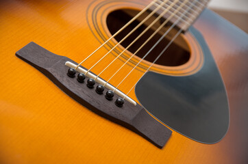 Fototapeta premium Acoustic guitar with very shallow depth of field