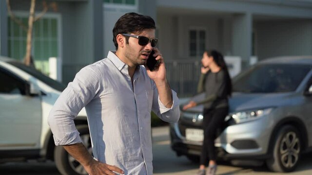 stress man motorists calling insurance company on mobile phone to responsibility for car accident traffic collision after a car accident on the road with driver woman