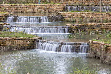 The stream trickled down from a high place