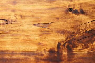 Fototapeta na wymiar The texture of a wood board painted in walnut color and coated with wood oil. Background from a wooden board. 