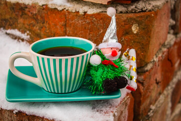 Christmas grandpa on a green set cup with a saucer with black coffee 
