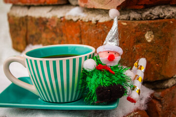 Christmas grandpa on a green set cup with a saucer with black coffee 