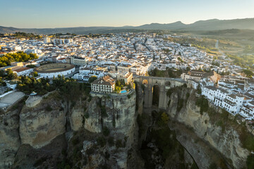 Beautiful landscape of Ronda city from Andalusia, Spain. Wide angle panoramic view from above with the Puente Nuevo bridge and bull fighting arena.
