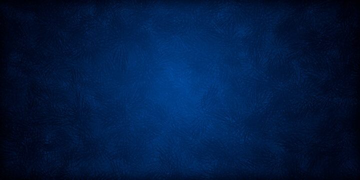 Fondo azul de pared con manchas oscuras.