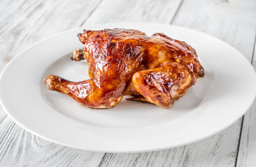 Roasted chicken on the white plate