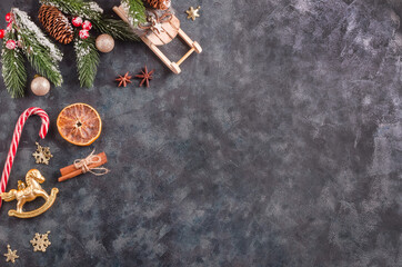 Christmas background, festive paraphernalia and Christmas decorations on a black background with copy space