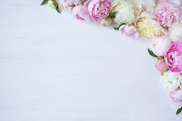 Obraz na płótnie Canvas White wooden background with flowers peonies, space for text.