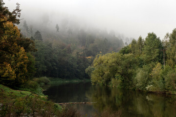 Sázava river in the middle of forests in the fog