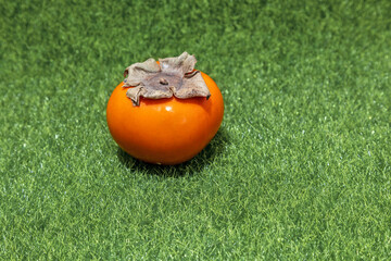 Naklejka premium orange shape on green background