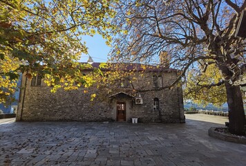 kypseli village central square in autumn season tables chairs plane tree arta perfecture greece