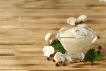 Concept of tasty food with mushroom sauce on wooden background