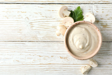 Fototapeta na wymiar Concept of tasty food with mushroom sauce on white wooden background
