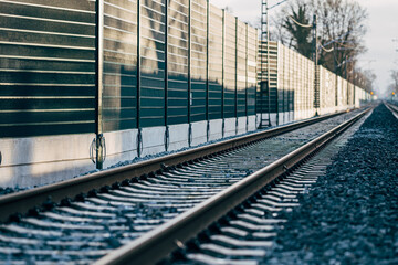 Railroad noise barrier. Acoustic wall reducing train sound. Soundproof protection fence along the...