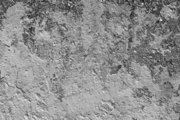 Texture of a concrete wall with cracks and scratches which can be used as a background