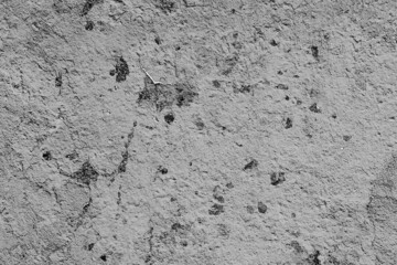 Texture of a concrete wall with cracks and scratches which can be used as a background