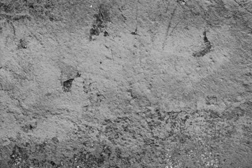 Texture of a concrete wall with cracks and scratches which can be used as a background