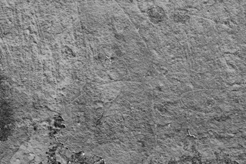 Texture of a concrete wall with cracks and scratches which can be used as a background