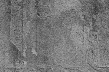 Texture of a concrete wall with cracks and scratches which can be used as a background